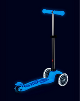 Blue scooter with glowing effect on a black background