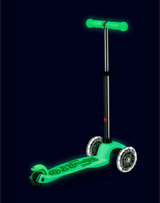 Glowing green scooter on a black background