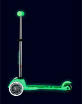 Glowing green scooter on a black background