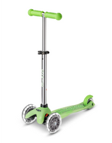 Green scooter with silver accents on a white background