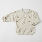 Beige bib with floral patterns on a white background