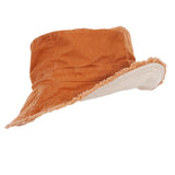 Brown bucket hat with white trim on a white background
