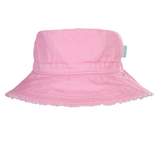 Pink bucket hat with frayed edge on a white background