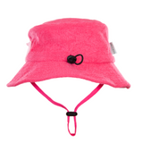 Pink bucket hat with chin strap on a white background