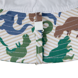 Close-up of a fabric with dinosaur pattern and white strap