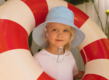 Child holding a red & white stripe floating device wearing a Blue and white checkered bucket hat and white tee.