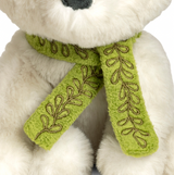 Detailed view of green tie around neck of Arctic Fox plush