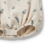 Detailed view of snap crotch opening on WILSON & FRENCHY Little Olive Organic Waffle Bodysuit