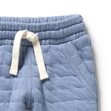 Detail view of elasticised tie waistband and pocket