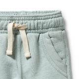 Detail view of elasticised tie waistband and front pocket