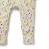 Detailed view of two-way leg zip on WILSON & FRENCHY Bella Floral Organic Zipsuit With Feet