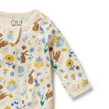 Detailed view of zip covered neck opening on WILSON & FRENCHY Daisy Mae Organic Zipsuit With Feet