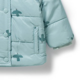 Detailed view of covered buttons, side pocket and sleeve of WILSON & FRENCHY Little Sparrow Puffer Jacket