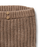 Detail view of WILSON & FRENCHY Coco Speckle Organic Knitted Legging waistband and wooden buttons