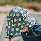 Top view of baby wearing BEDHEAD HATS Swim Legionnaire Hat - Turtle