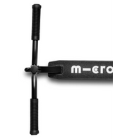 Black scooter with 'micro' branding on a white background