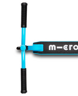 Close-up of a scooter with 'micro' branding on a white background