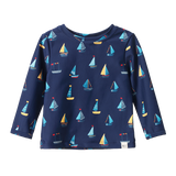 Navy long-sleeve rash vest with sailboat pattern on a white background