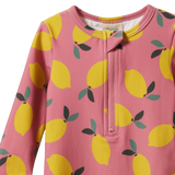 Pink children's swimsuit with lemon pattern on a white background