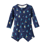 Navy blue children's swimsuit with sailboat pattern on a white background