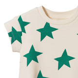 Off-white romper with green star patterns on a white background