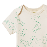 Beige t-shirt with green elephant patterns on a white background