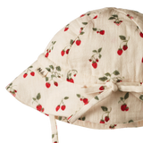back view of hat with strawberry pattern on a white background