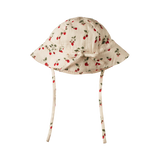 Strawberry patterned baby sun hat on a white background