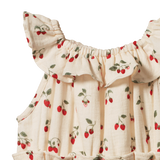 Baby romper with strawberry pattern on a white background