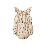 Baby romper with strawberry pattern on a white background