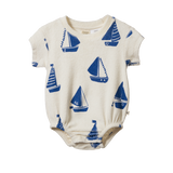 Baby romper with blue sailboat pattern on a white background
