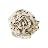 Rolled-up fabric with sailboat pattern on a white background