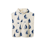 Children's hooded towel with blue sailboat pattern on a white background