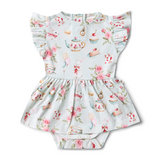 Floral baby romper with tea party design on a white background