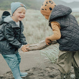 Kids playing outside wearing beanies