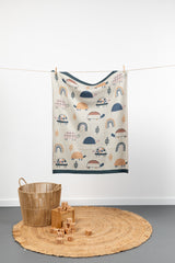 INDUS DESIGN Tilly Turtle Baby Blanket hanging on a string