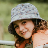 Child wearing the BEDHEAD HATS Kids Classic Bucket Sun Hat - Treadly