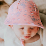 Baby wearing the BEDHEAD HATS Legionnaire Flap Sun Hat - Butterfly 