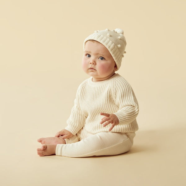 Baby wearing WILSON + FRENCHY Ecru Knitted Ribbed Jumper