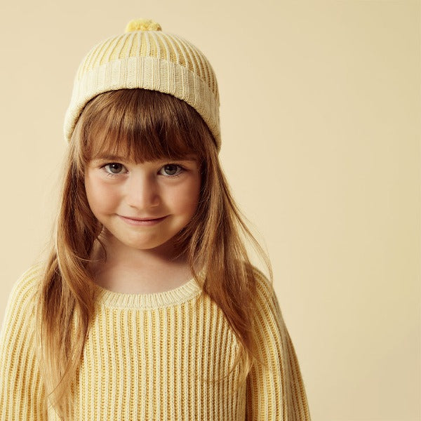 Child wearing WILSON + FRENCHY Dijon Knitted Ribbed Hat and matching jumper