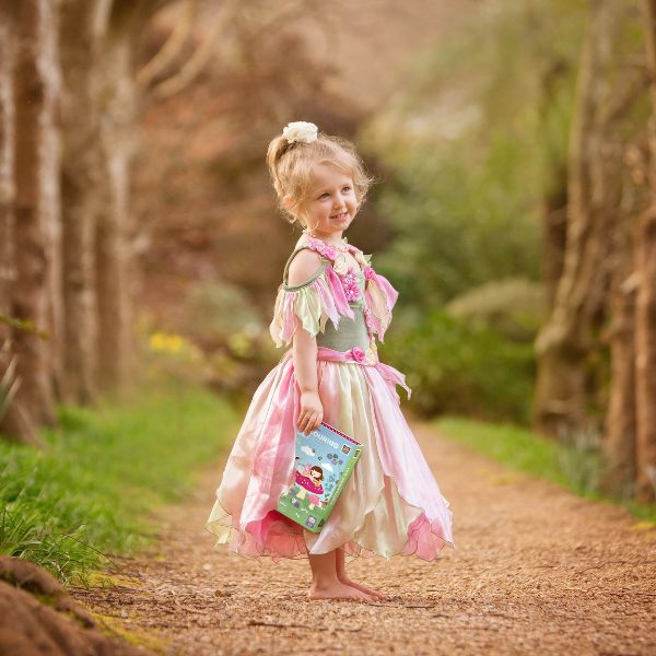 Child wearing a fairy dress holding the TIGER TRIBE Colouring Set - Forest Fairies