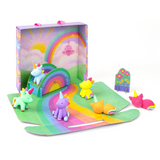 Colorful unicorn toy set with a rainbow and castle in a box on a white background