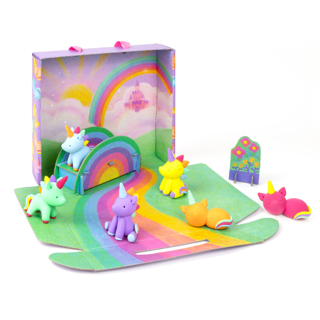 Colorful unicorn toy set with a rainbow and castle in a box on a white background