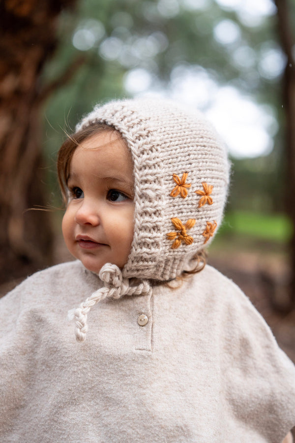 Toddler wearing ACORN Flowers Bonnet Oatmeal 