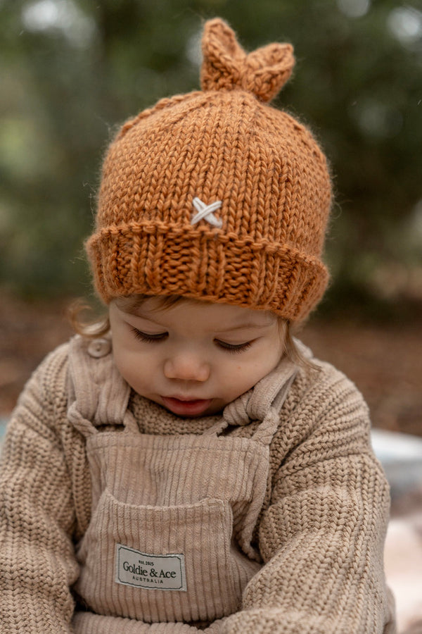Baby wearing ACORN Cottontail Beanie Caramel