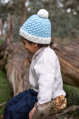 Side view of child wearing ACORN Ripples Beanie Blue