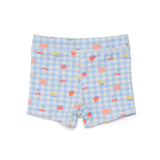 Back view of blue Checkered swim shorts with heart and cherry pattern on a white background