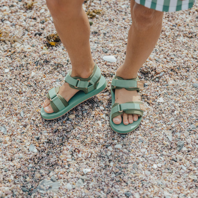 Child wearing CRYWOLF Beach Sandal - Coastal Green - top view