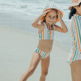 Child at beach wearing CRYWOLF Bikini - Summer Stripe and matching reversible bucket hat