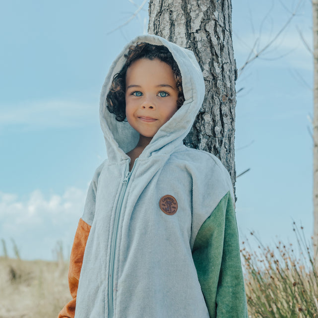 Child wearing the hood up on the CRYWOLF Everywhere Zip-Up Towel - Ocean Colour Block